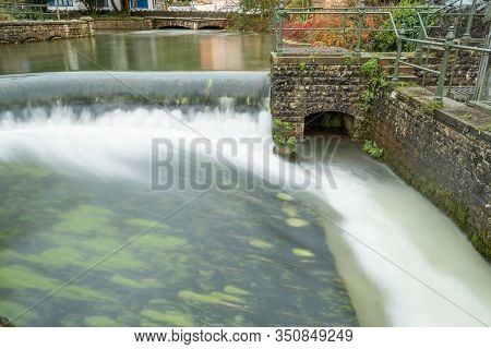 Long Exposure Of A Waterfall In Cheddar Village In Somerset