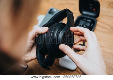 Paris, France - Oct 30, 2019: Overhead View Of Woman Hands Testing Beats Pro Witn New Apple Computer