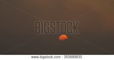 Dark Sunrise With Orange Small Sun With Fog In North Bohemia