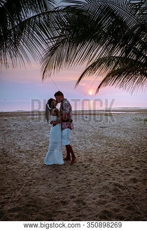 Chumphon Thailand, Couple Watching Sunset On The Beach In Thailand