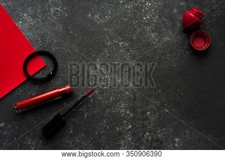 Lipstick And Lip Balm On A Black Background