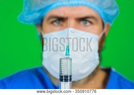 Doctor With Syringe. Medicine. Closeup. Concept Of Vaccination. Doctor With Syringe Preparing For In