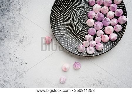 Meringues On A Round Plate On A White Background