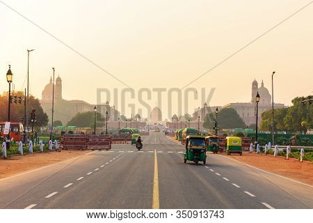 Sunset Traffic In New Delhi, Tuc Tuc Cars On The Road To The Presidential Residance