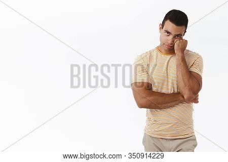 Bored And Unamused Caucasian Man Standing White Background Reluctant, Lean On Fist And Looking Unimp