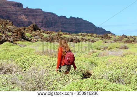 Spring Time Hike. Back View Of Girl Exploring The Northern Of The Island Of Lanzarote. Young Female 