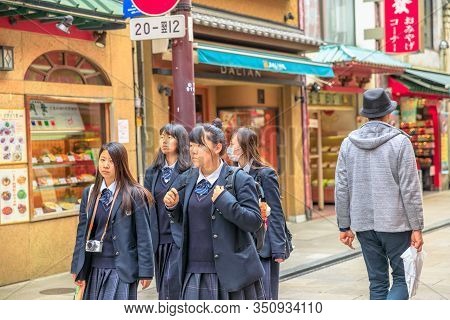 Yokohama, Japan - April 21, 2017: Group Of Asian Girls In School Uniform Wear A Mask While Walking I
