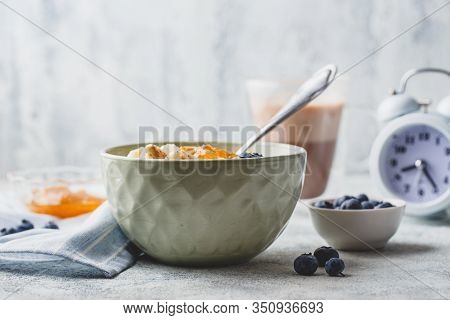 Breakfast With Milk Rice Porridge With Banans, Blueberry And Orange Jam, Creamy Rice Pudding Or Fren
