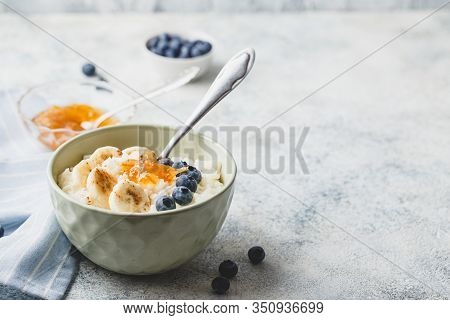 Breakfast With Milk Rice Porridge With Banans, Blueberry And Orange Jam, Creamy Rice Pudding Or Fren