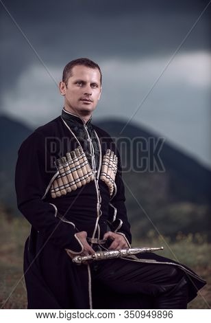 A Man In Nature In National Clothes Of Georgia.