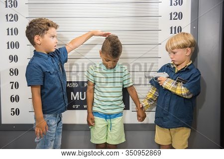 Little Boys Playing Police In Entertainment Center. Children Playing Indoor. Childrens Role Playing 