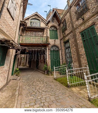 Gonzalez Catan, Argentina, September 28, 2019: Cobblestone Path Through Abandoned Buildings In The A