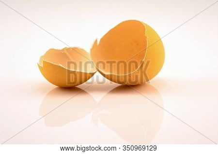Empty Egg Shells After The Chicken Has Hatched And Left, Isolated On A White Background