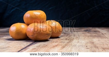 Tangerines (oranges, Mandarins, Clementines, Citrus Fruits) Over Rustic Wooden Background, Copy Spac