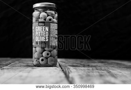 Perth, Scotland - 11 November 2019: Jar Of Green Pitted Olives In Brine