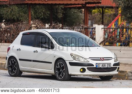 Side, Turkey - February 06 2022: White Peugeot 307   Is Parked  On The Street On A Warm Summer Day A