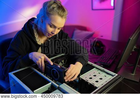 E-sport Gamer Girl Installing New Gpu Video Card In Her Gaming Pc