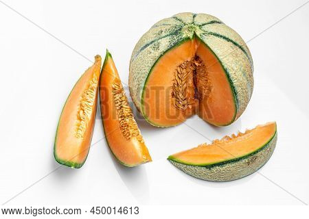 Sliced Cantaloupe Melon. Raw Organic Tuscan Melon Cantaloupe Isolated On White Background, Banner, M
