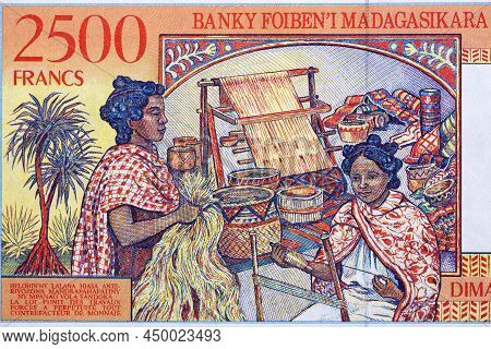 Woman Weaving From Malagasy Money - Ariary