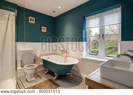Cavendish, Suffolk - Jan 19 2019: Typical Modern Bedroom With Slatted Wooden Bed And Sidetables With