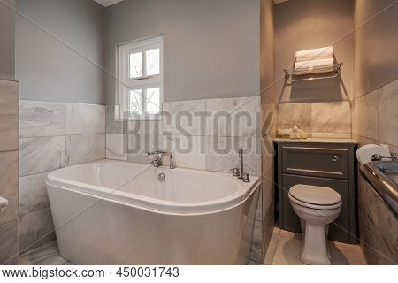 Newmarket, Suffolk - March 11 2019: Luxury Modern Bathroom Decrated In Grey And White