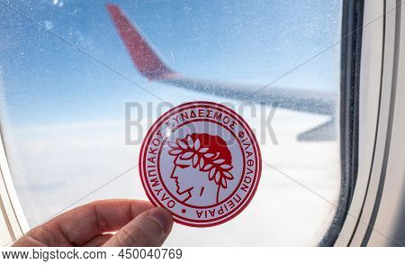 December 6, 2021. Athens, Greece. The Emblem Of The Olympiacos F.c. Football Club On The Background 