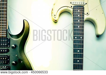 Two Guitar, Neck Fretboard And Dirt Blue White Background.
