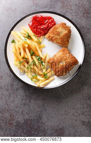Breaded Spanish Steak Cachopo Served With French Fries Close-up In A Plate On The Table. Vertical To