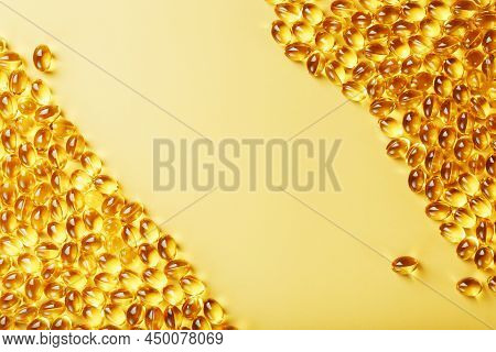 Capsules In A Shell With Liquid Vitamin D3 On A Yellow Background And A Place For Text