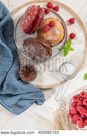 Bolas De Berlim, Or Berlin Balls. Portuguese Fried Dough With Sugar, Filled With Chocolate Or Raspbe