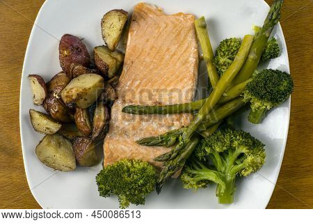 Baked Salmon With Vegetables And Served With Homefries