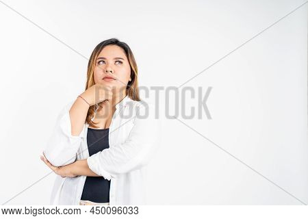 Sad Portrait Of Young Asian Woman Feeling Uncertain Looking Up Thinking