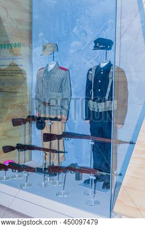Pohang, South Korea; Jan. 7, 2022: Uniforms And Guns Used By Korean Student Soldiers At Jangsari Lan