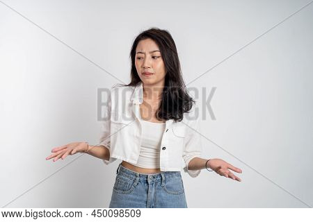 Sad Portrait Of Young Asian Woman Over Isolated Background