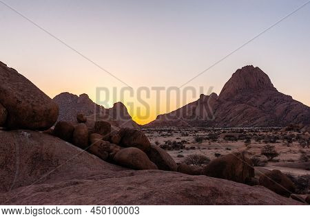 Impression Of The Rocky Namibian Desert Near Spitzkoppe During The Golden Hour Around Sunset.