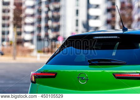 Riga, Latvia - 26 March, 2021: Close-up Of The Green Electric Vehicle Opel Mokka-e, Future Technolog
