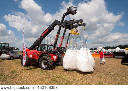 Belogorye, Khmelnytsky Region, Ukraine - August 19, 2021: Loader Manitou With Bags Of Seeds At The E