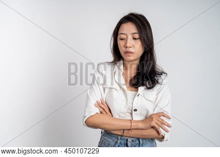 Sad Portrait Of Young Asian Woman Over Isolated Background