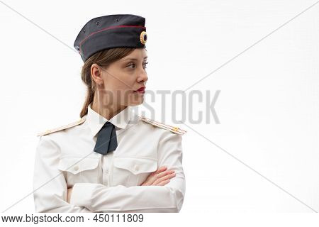A Beautiful Young Female Russian Police Officer In Dress Uniform In A Cap And Shoulder Straps Of A L