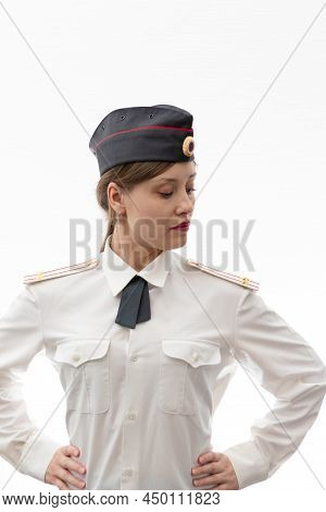 A Beautiful Young Female Russian Police Officer In Dress Uniform In A Cap And Shoulder Straps Of A L