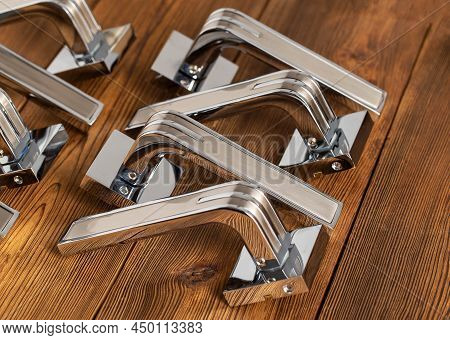 Chromed Door Handles For Wooden Doors. Door Furniture, Close-up