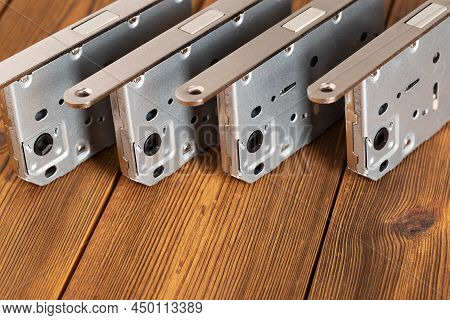 Door Latch Plumbing Magnetic On A Wooden Background. Door Furniture, Close-up