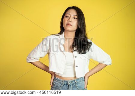 Sad Portrait Of Young Asian Woman Over Isolated Background