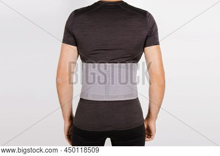 Lumbar Brace On The Human Body Isolated On A White Background. Trauma Of Back. Back Brace, Orthopedi