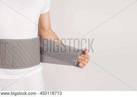 Lumbar Brace On The Human Body Isolated On A White Background. Trauma Of Back. Back Brace, Orthopedi