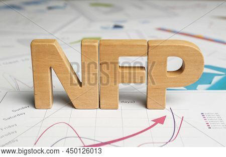 Wooden Letters Nfp On Documents With Charts