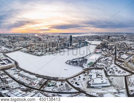 Yekaterinburg Aerial Panoramic View In Winter At Sunset. Yekaterinburg City And Pond In Winter.