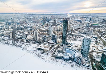 Yekaterinburg Aerial Panoramic View In Winter At Sunset. Yekaterinburg City And Pond In Winter.