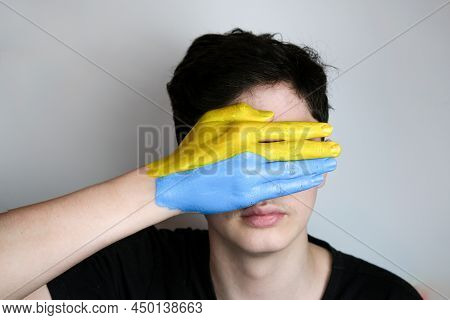 Hand Painted In The Colors Of The Flag Of Ukraine. War In Ukraine. The Concept Of War In Ukraine. Th