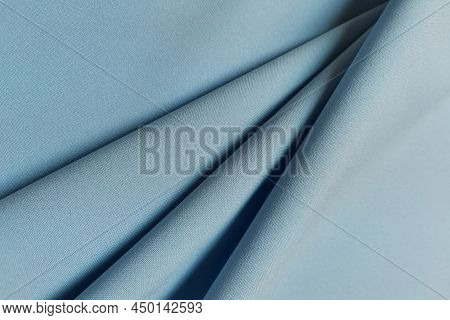 Blue Crumpled Or Wavy Fabric Texture Background. Abstract Linen Cloth Soft Waves. Gabardine Wool Fab